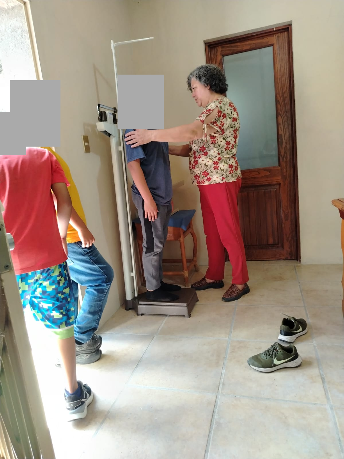 Medical Care: Weight and Height Measurements, with Children's Faces Concealed