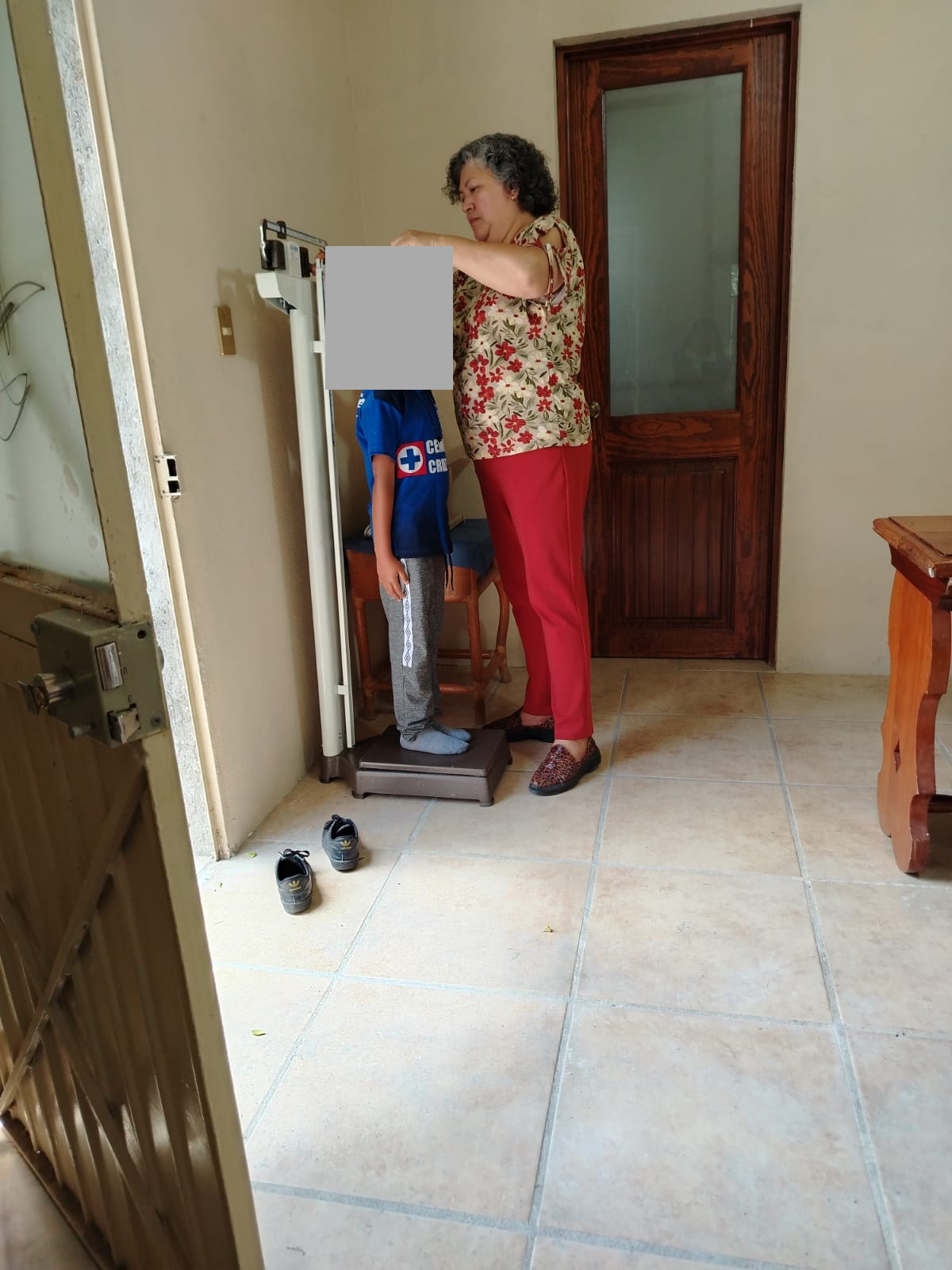 Medical Care: Weight and Height Measurements, with Children's Faces Concealed